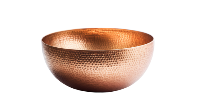 A shiny hammered copper bowl isolated on white background
