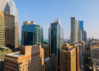 Obraz premium Row of Tall modern office and apartment buildings in Chicago Downtown aerial view.