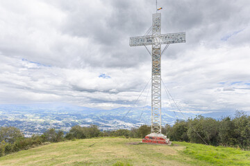 Valley of the Chillos, Ecuador – June 9, 2025: The Ilalo cross atop Ilalo volcano stands out...