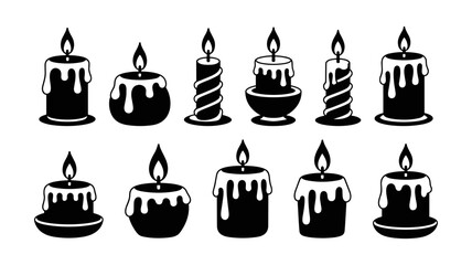 Collection of decorative black and white candles with dripping wax