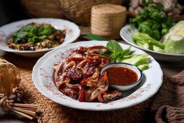 Traditional Thai food,Grilled intestines with Spicy minced catfish salad, thai called larb pla duk	, Roasted pork Chitterlings, Thai call Sai-On Yang, Thai food