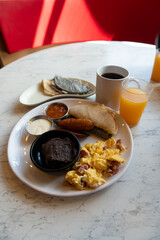 Traditional Central American Breakfast with Scrambled Eggs, Plantains and Black Beans