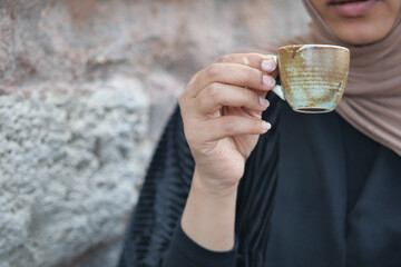 Woman Enjoying traditional turkish coffee 