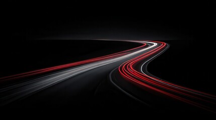 Curving highway at night with light trails.