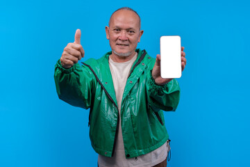 Mature Asian Man Giving Thumbs Up Holding Blank Smartphone Screen