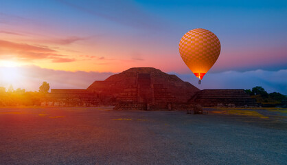 Hot air balloon flying over Teotihuacan pyramids complex located in Mexican Highlands and Mexico...