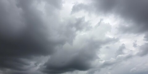 Fototapeta premium Overcast day, dark gray clouds covering the entire sky, no sun visible, gray, photography