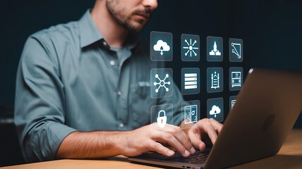 Man using laptop with digital interface showing technology icons image