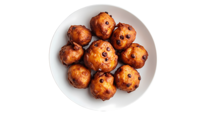 A top view of a white plate filled with golden brown fried dough balls isolated on white background