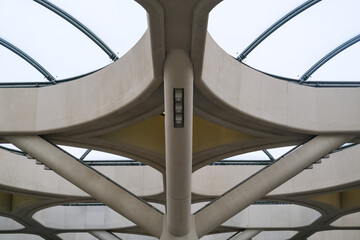 Massive rooftop structure with bold geometric forms and skylight panels showcases monumental...