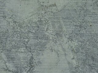 Rough scratched blue concrete surface with diagonal marks and textured imperfections