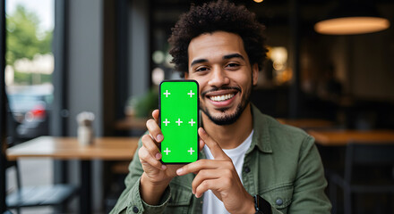 Young Professional Displaying Smartphone with Green Screen for App or Content