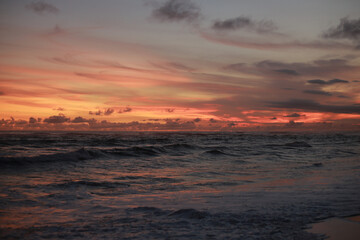 Orange Sunset with Soft Clouds over the Ocean