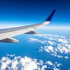 Airplane wing over clouds
