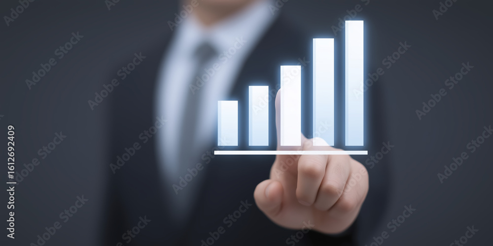 Poster business professional in a suit interacting with a digital graph display, showcasing upward trends a
