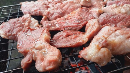 Pork grilled on a charcoal grill