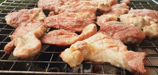 Pork grilled on a charcoal grill
