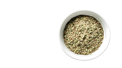 A top down view of dried herbs in a white bowl isolated on white background