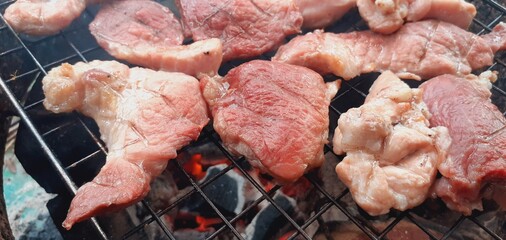 Pork grilled on a charcoal grill