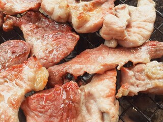 Pork grilled on a charcoal grill