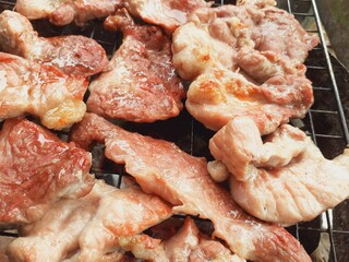Pork grilled on a charcoal grill