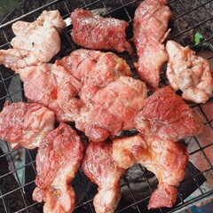Pork grilled on a charcoal grill