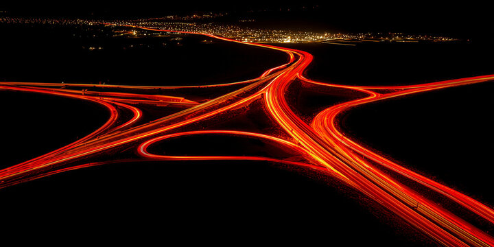 Highway interchange with red light trails at night - Powered by Adobe