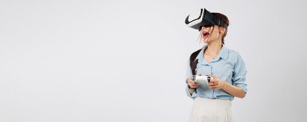 Game immersion begins as excited young woman in headset plays VR game using joystick, discovering...