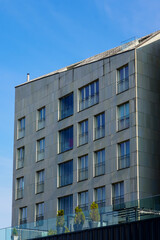 Modern architectural design in Porto Franco district captured in 2025 against a clear blue sky