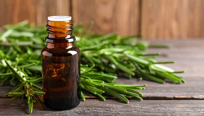 Amber bottle of rosemary oil surrounded by sprigs