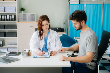 Portrait of female doctor explaining diagnosis to her patient. Doctor Meeting With Patient In Exam...