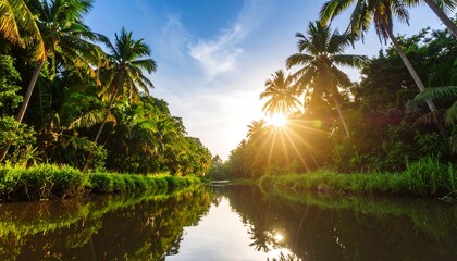 Obraz premium Calm waterway winds through lush tropical foliage, sun setting over tranquil waters