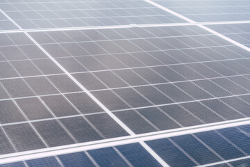 Solar panels installed on a rooftop harnessing sunlight for energy production in a modern urban...