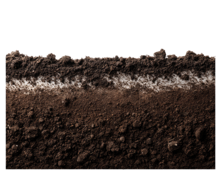 Close-up view of soil layers, dark brown top layer with lighter layer beneath, showing texture and subtle variations