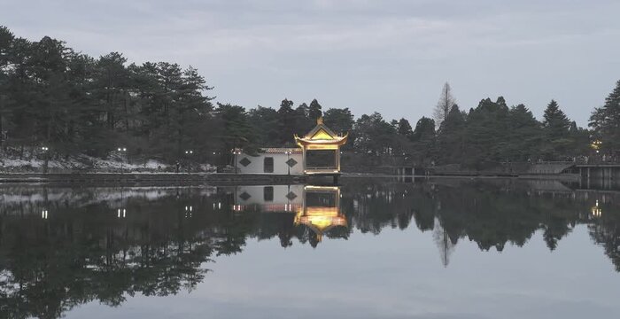 Timelapse of Jiangxi Lushan's Ruqin Lake reflecting night lights and tranquil nature