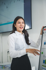 Young professional asian businesswoman explaining business growth using charts and graphs on...