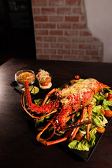 Grilled Lobster Served on Fresh Salad with Gourmet Sides