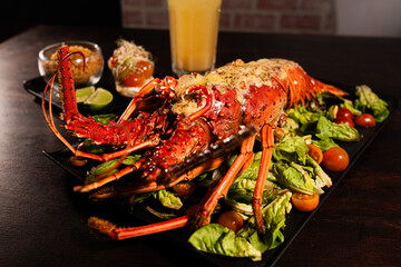 Grilled Lobster Served on Fresh Salad with Gourmet Sides