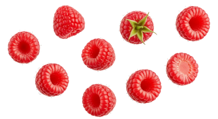 Fresh raspberries vibrant red hues and one with green sepals arranged in a scattered composition.