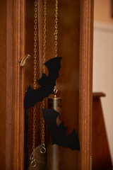 Chains and Shadows in Wooden Clock