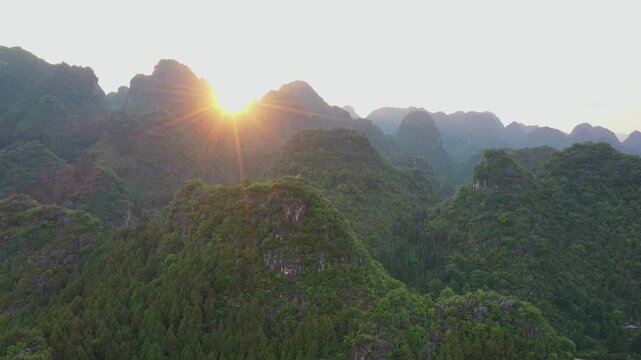 Sunrise over Wanfenglin Scenic Spot in Guizhou captures breathtaking aerial views of mountains and nature's beauty