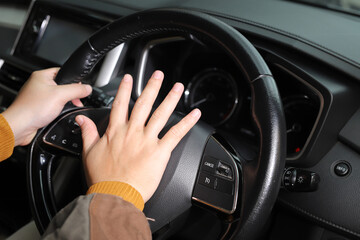 The sudden sound of a car horn startled pedestrians and they turned to look