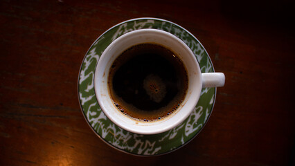 Traditional Black Coffee in Green Enamel Cup