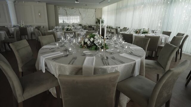 luxury wedding reception table with floral centerpiece and glassware set for celebration