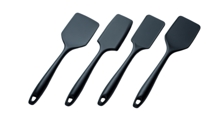 Four dark gray/black silicone spatulas of varying sizes,  arranged horizontally on a dark background.  Handles are long and smooth, blades are flat and  rectangular