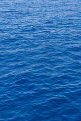 Water background texture. Sea surface in sunset light. Breezy wavy seawater. Sea water texture. Teal blue ocean view. Fresh water of lake. Relaxing natural photo wallpaper. Still water surface