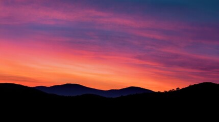 Pink And Orange Sunset Over Rolling Hills Silhouette. High quality