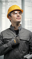 proud builder in protective gear looking into the distance on geometric background . Generative AI