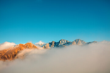 Mountains minimalist landscape. Peaks of the mountains above the clouds. Pyrenees, Andorra, Europe