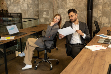 Colleagues working in the office and looking busy and involved